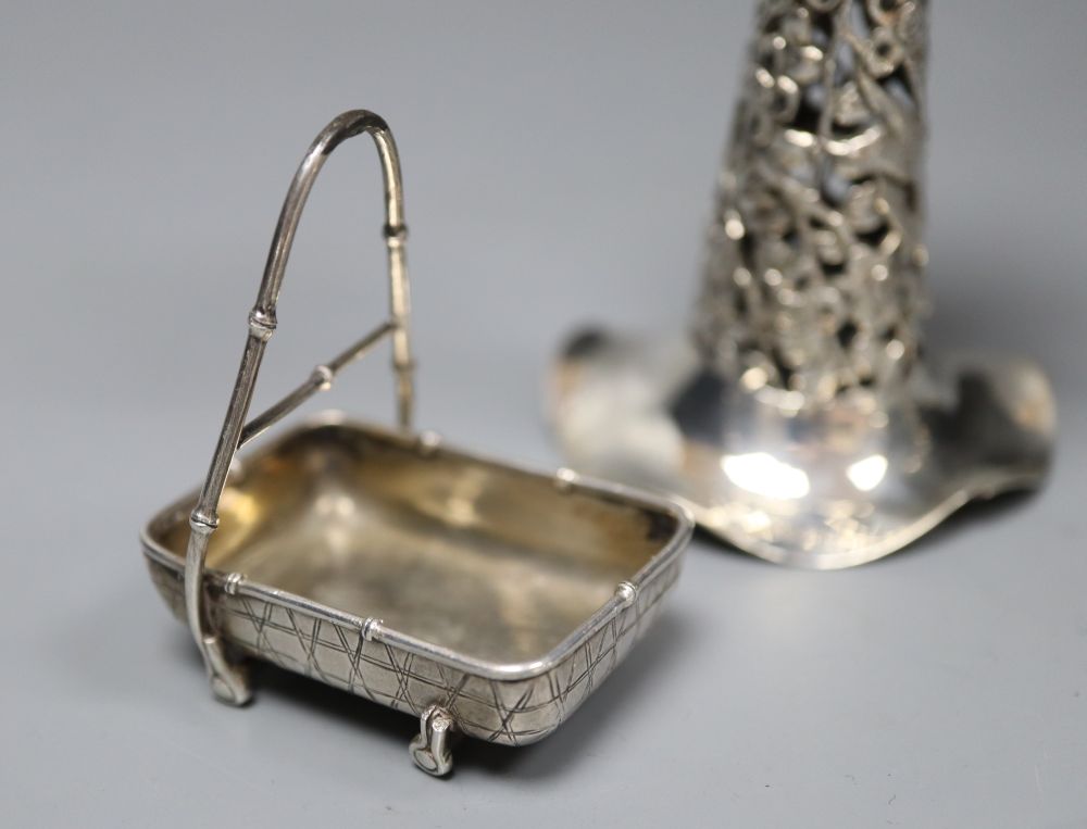 Two Dutch white metal sifter spoons, a Chinese white metal vase (base missing0 and two toy items, Dutch & Chinese.